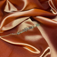 Load image into Gallery viewer, silk background with gold good pussy anklet from sweet nothings and co