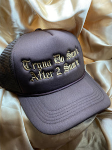 Brown foam trucker hat with beige writing saying "Tryna Do Sum'n After 2 Sum'n" 